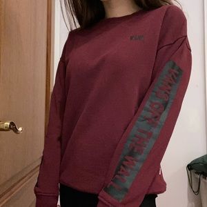 Vans maroon sweater off the wall